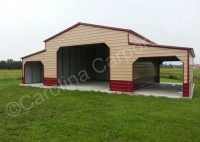 Vertical Roof Style Two Tone Carolina Metal Barn Fully Enclosed on Main Building